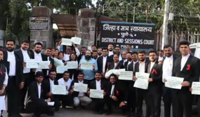 Placards displayed outside the court for the Lawyer Protection Act; Lawyers participate in the proceedings by wearing red ribbons